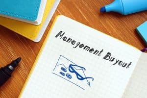 What is a management buyout?